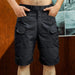 Short tactique homme noir avec poches cargo et ceinture ajustable taille M