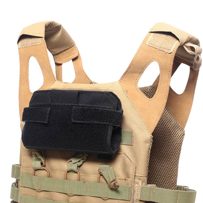 Black tactical card holder attached to a vest with velcro